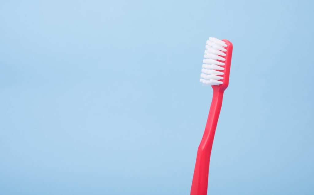 Image of red toothbrush